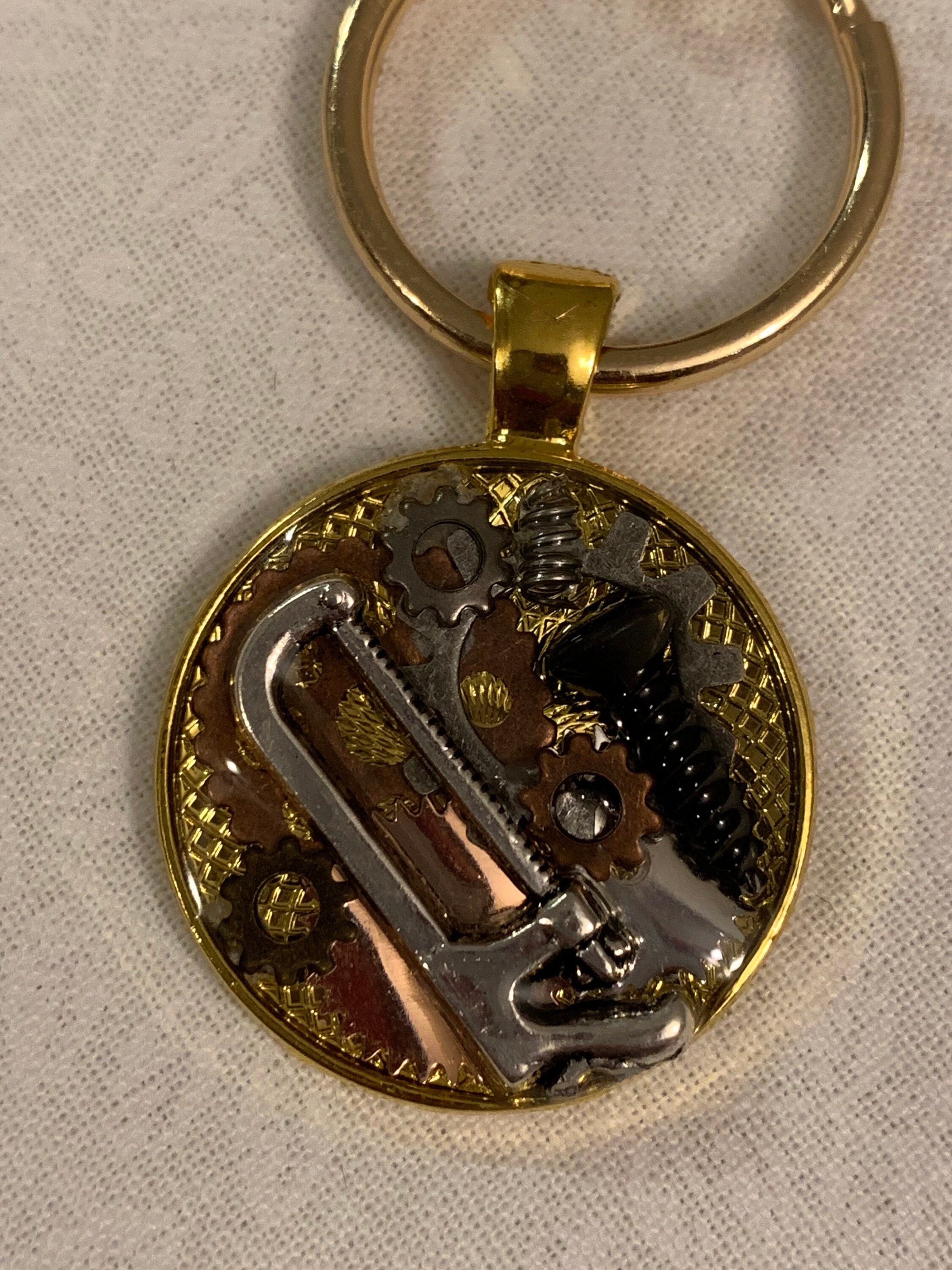 Gold steampunk saw keychain
