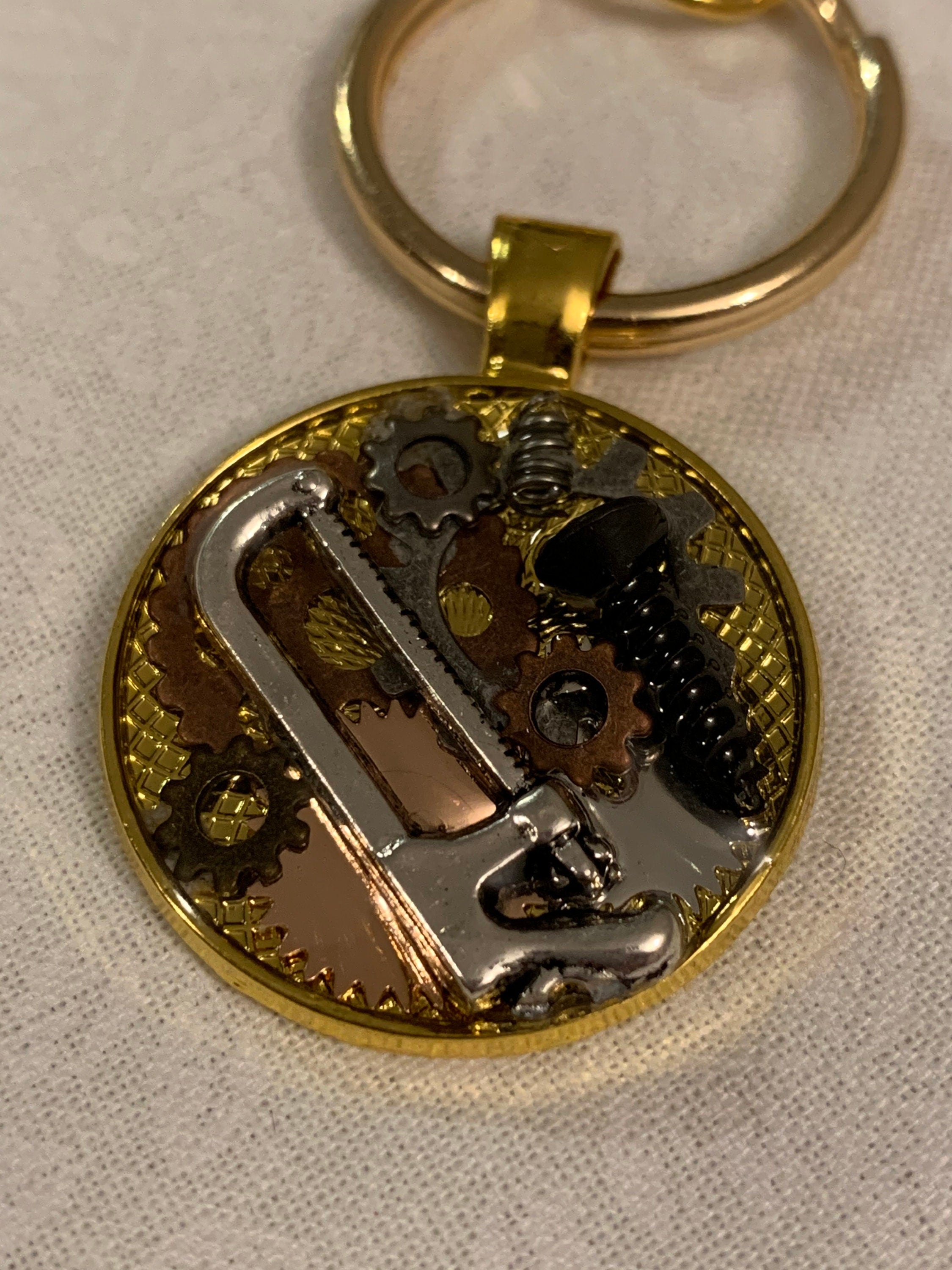 Gold steampunk saw keychain