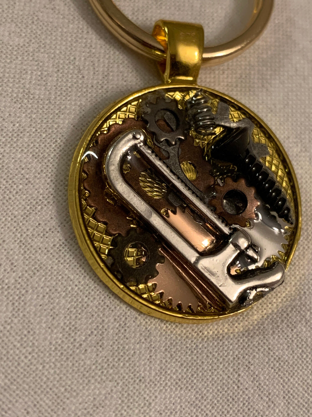 Gold steampunk saw keychain