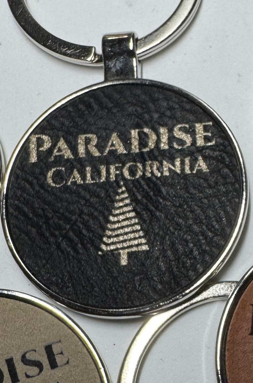 Metal Leatherette Paradise Keychain