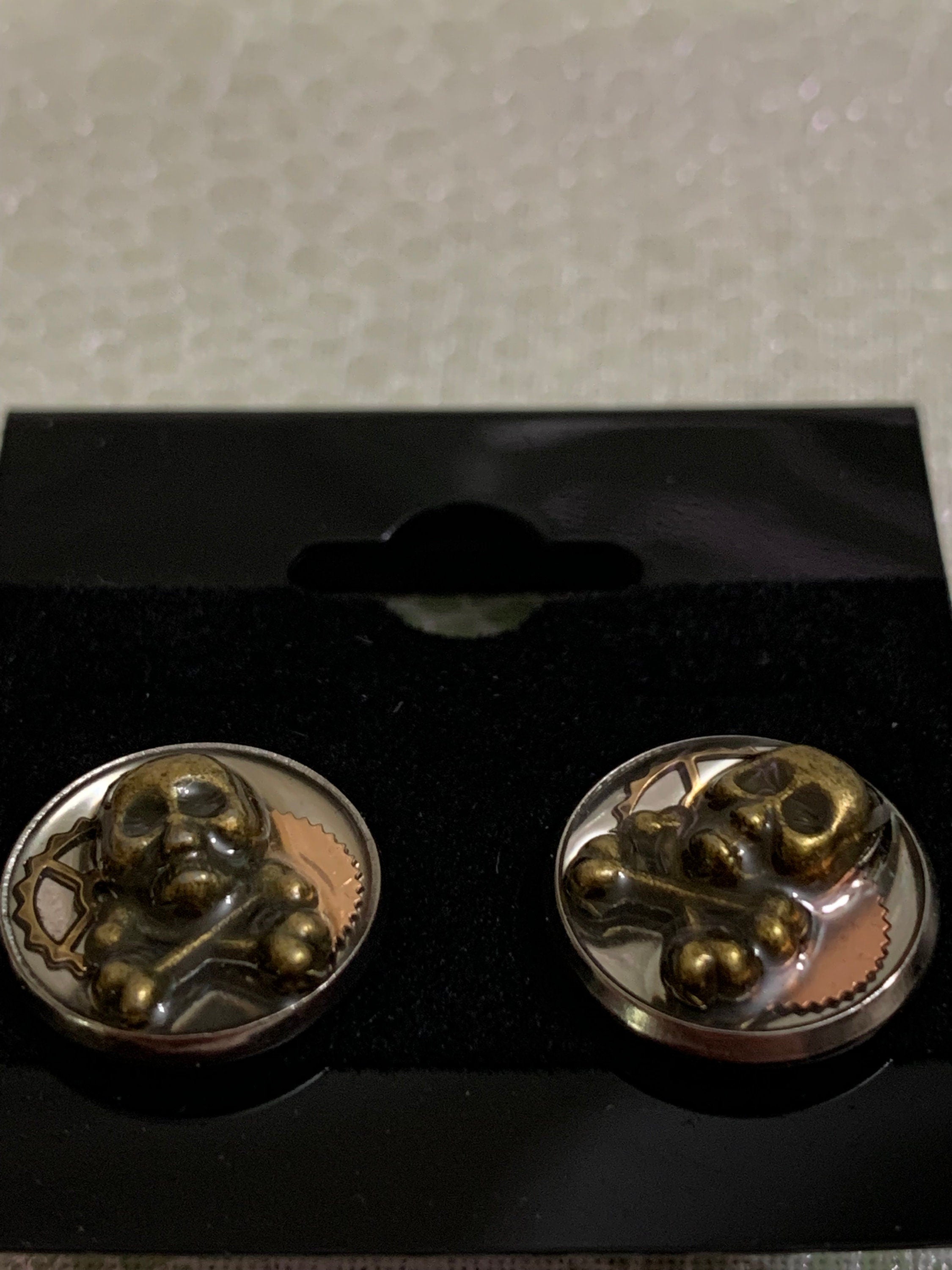 Different Pairs of Steampunk skull stud earrings
