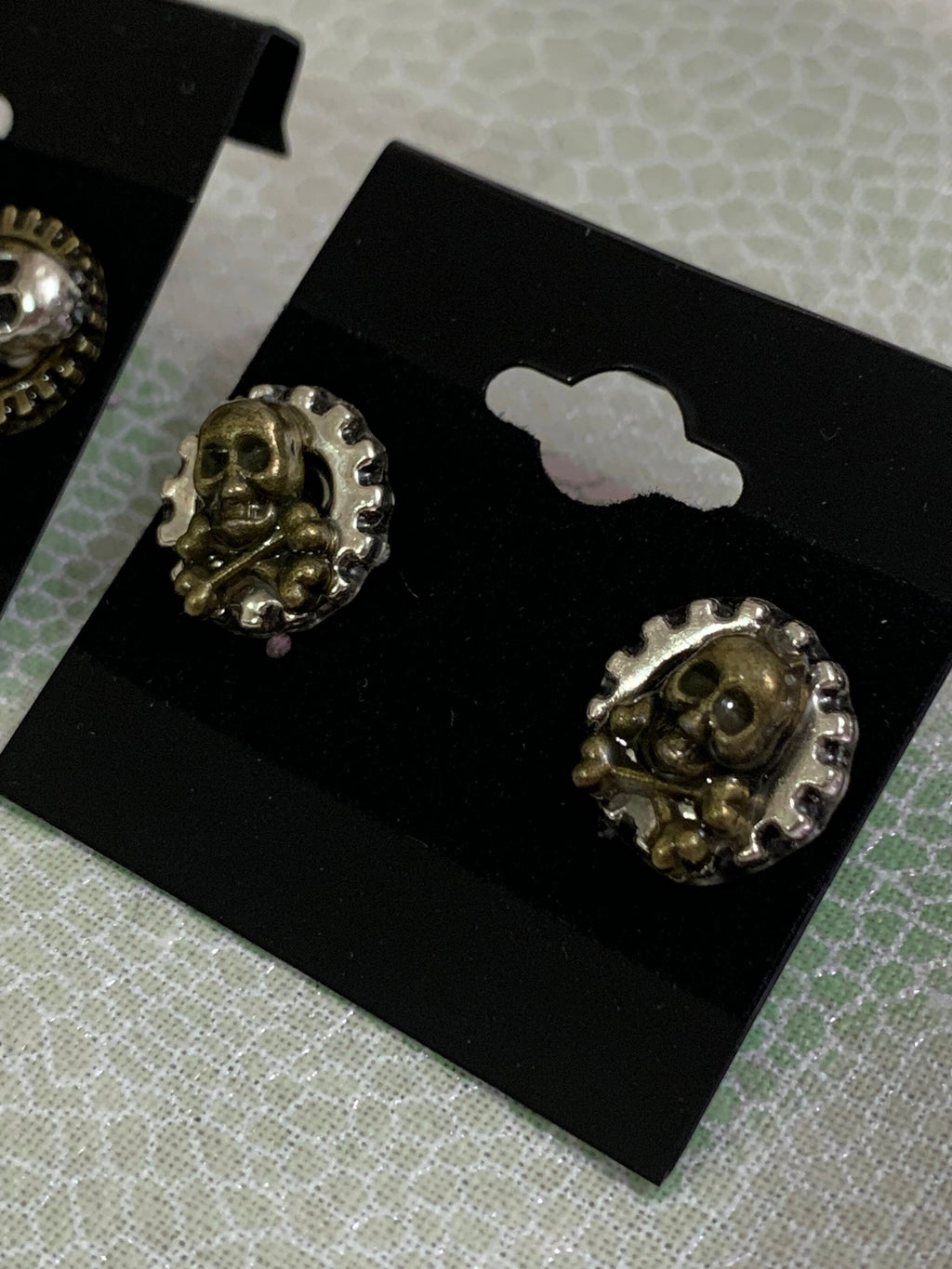 Different Pairs of Steampunk skull stud earrings