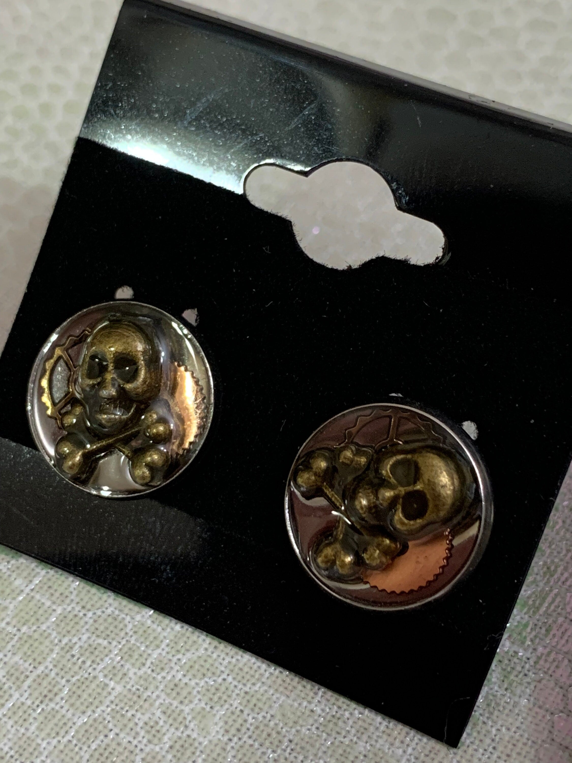 Different Pairs of Steampunk skull stud earrings