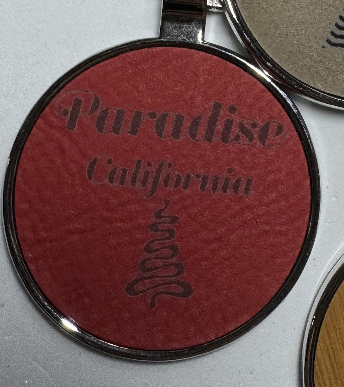 Metal Leatherette Paradise Keychain